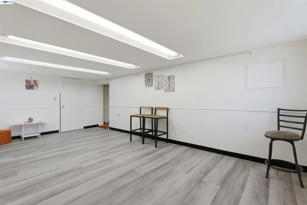 1st large room with new flooring. Potential kitchen/living/dining​​‌​​​​‌​​‌‌​​‌​​​‌‌​​​‌​​‌‌​​‌‌​​‌‌​​​​ room