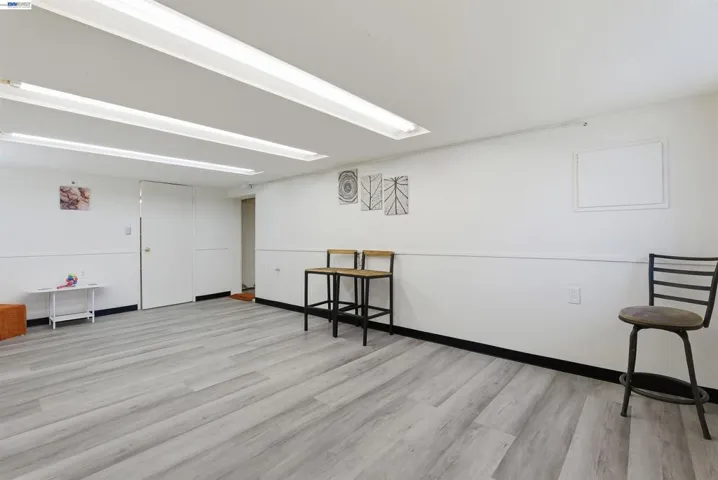 1st large room with new flooring. Potential kitchen/living/dining​​‌​​​​‌​​‌‌​​‌​​​‌‌​​​‌​​‌‌​​‌‌​​‌‌​​​​ room
