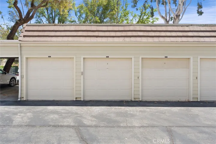 Detached single car garage and assigned covered carport