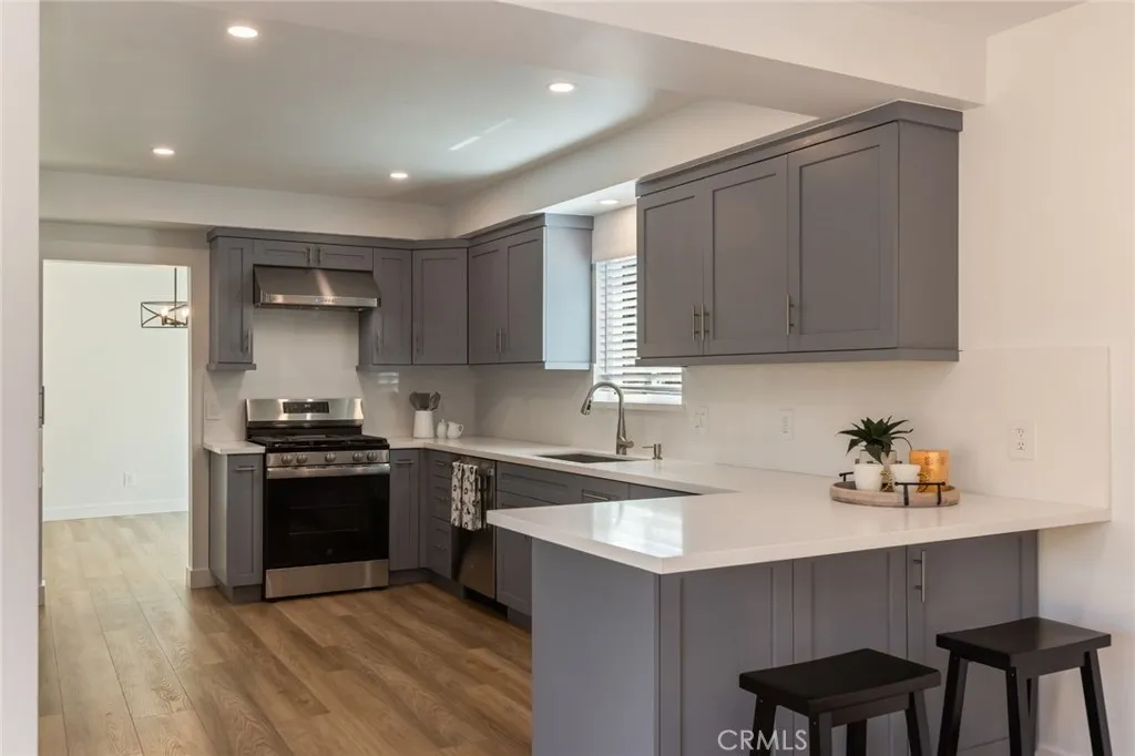 new stainless stove, hood and dishwasher