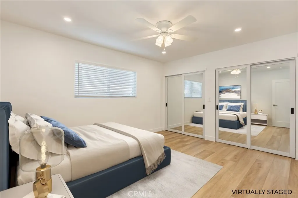 virtually staged bedroom 2 across from the primary bedroom