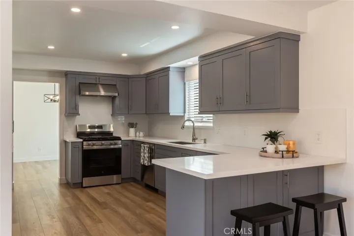 new stainless stove, hood and dishwasher