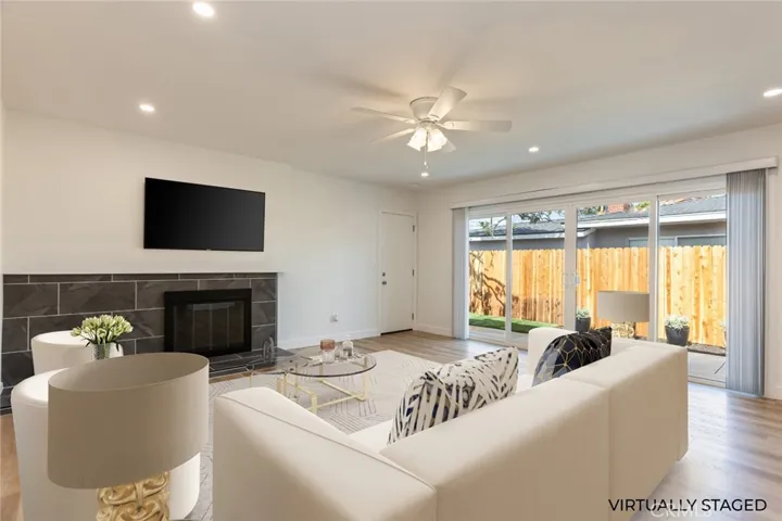 virtually staged family room with direct access from the garage