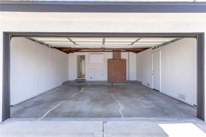 Finished walls in garage, Washer/dryer hookup and venting, Overhead laundry cabinet
