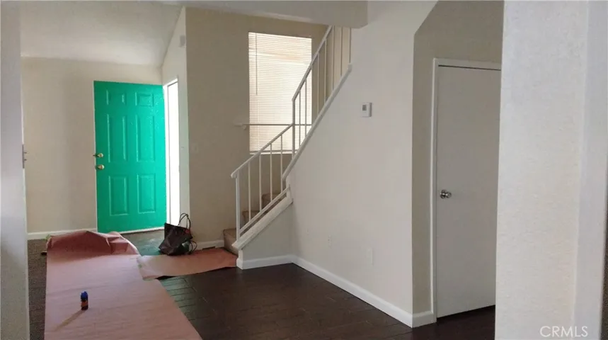 Front door to stairs going upstairs