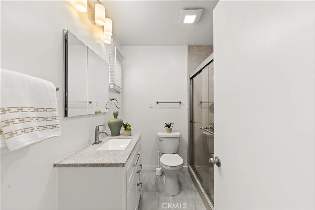 Bath with fresh paint and tile flooring.