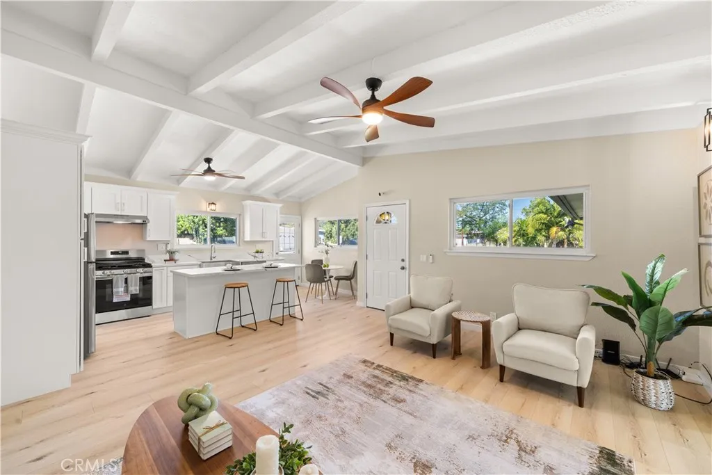 Large living room with ceiling fan.