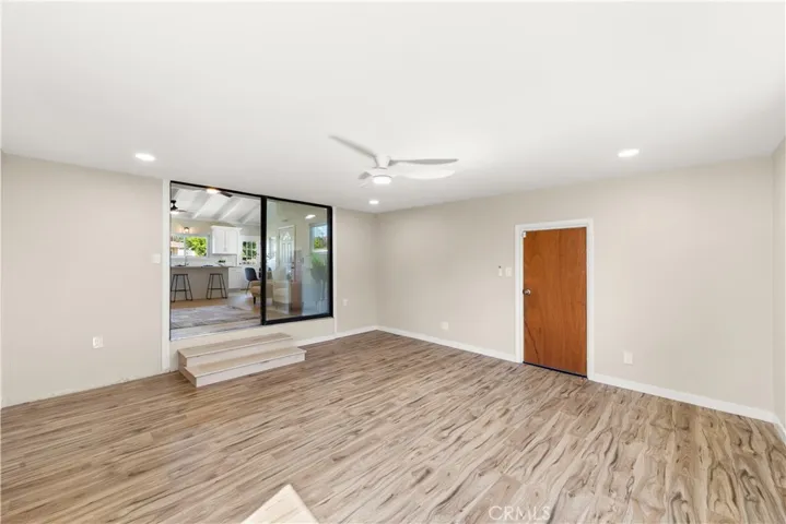 

Bright and airy family room with large windows that invite an abundance of natural light throughout the space.

