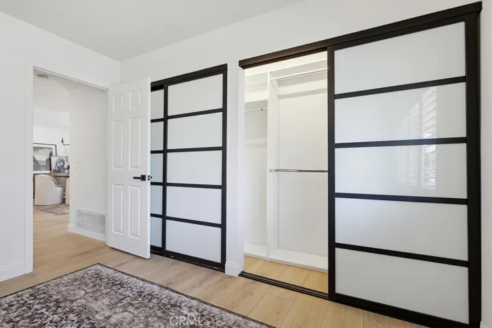 Primary Bedroom Closet w/built in shelves