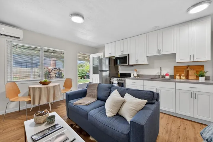 Eat-in area with a view of the backyard. Kitchen with stove, oven, microwave and refrigerator.