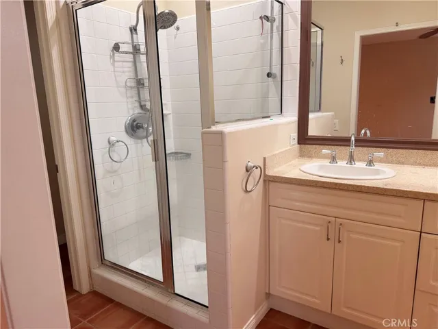 Primary bedroom with en-suite bath and large walk-in closet and fireplace.