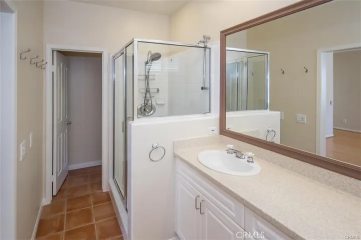 Primary bedroom with en-suite bath and large walk-in closet and fireplace.