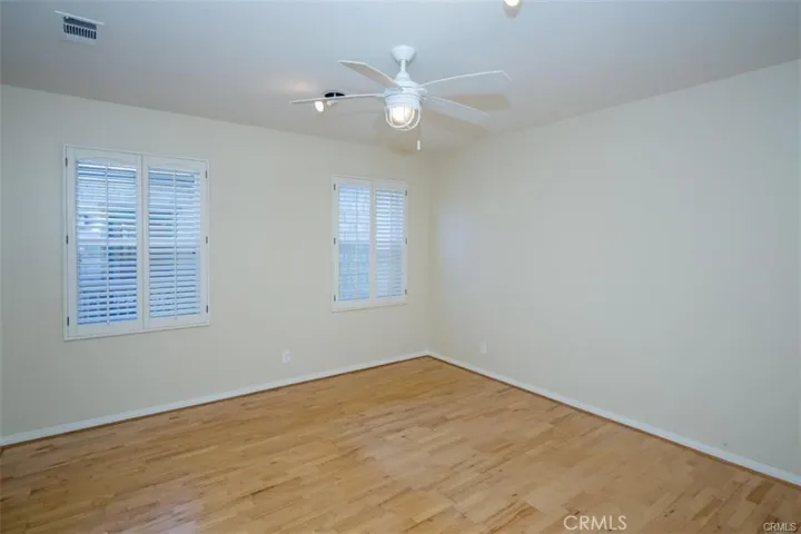 2 of 2 secondary bedrooms.  Both secondary bedrooms feature en-suite bath and walk-in closet.