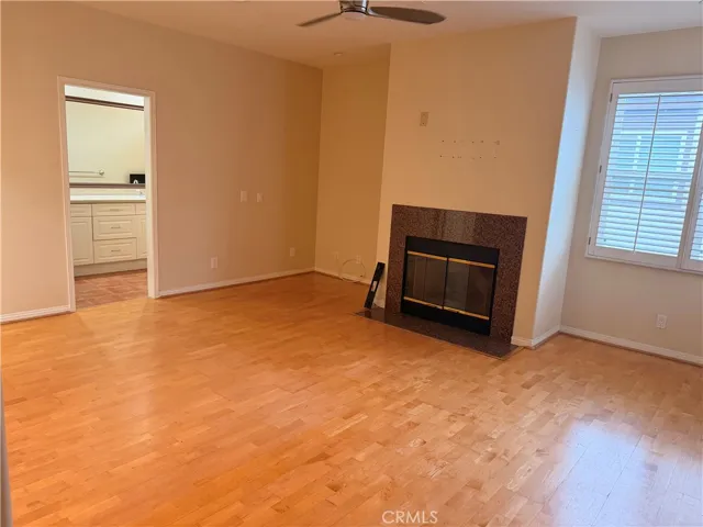 Primary bedroom with en-suite bath and large walk-in closet and fireplace.