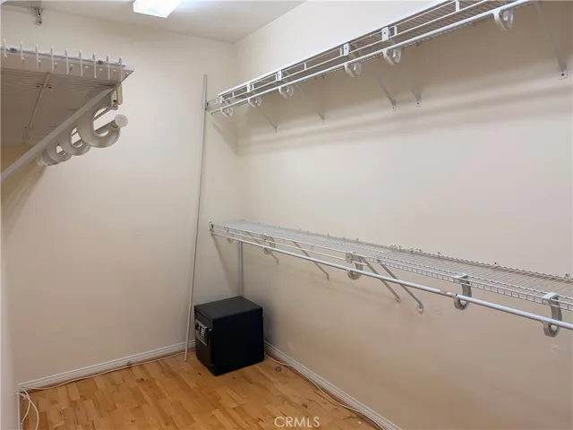 Primary bedroom with en-suite bath and large walk-in closet and fireplace.