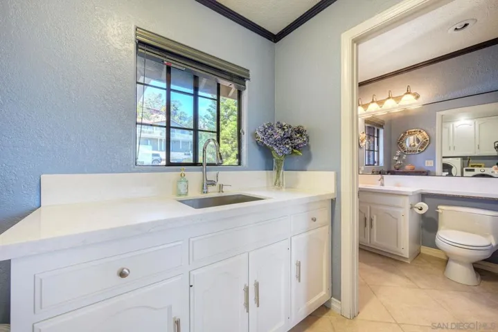 Bathroom & Laundry Room off Kitchen.