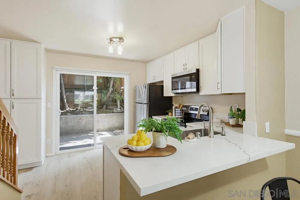 Open-concept kitchen with breakfast bar seating too!