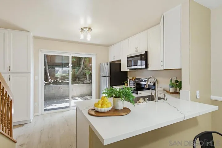 Open-concept kitchen with breakfast bar seating too!
