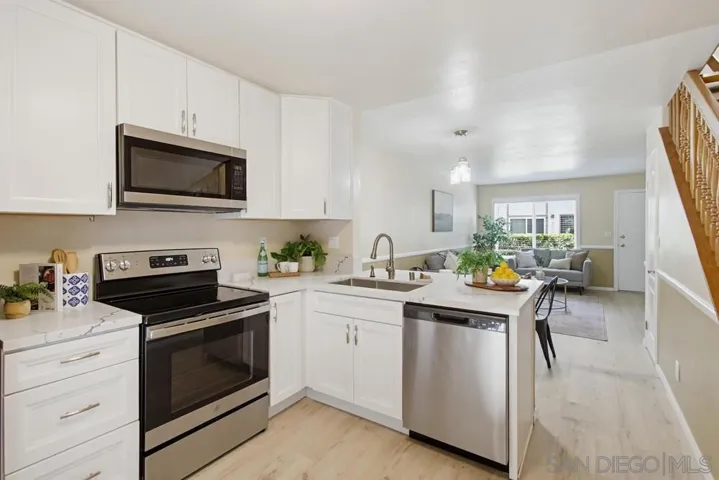 Quartz counters, stainless appliances, and loads of cabinet and counter space!
