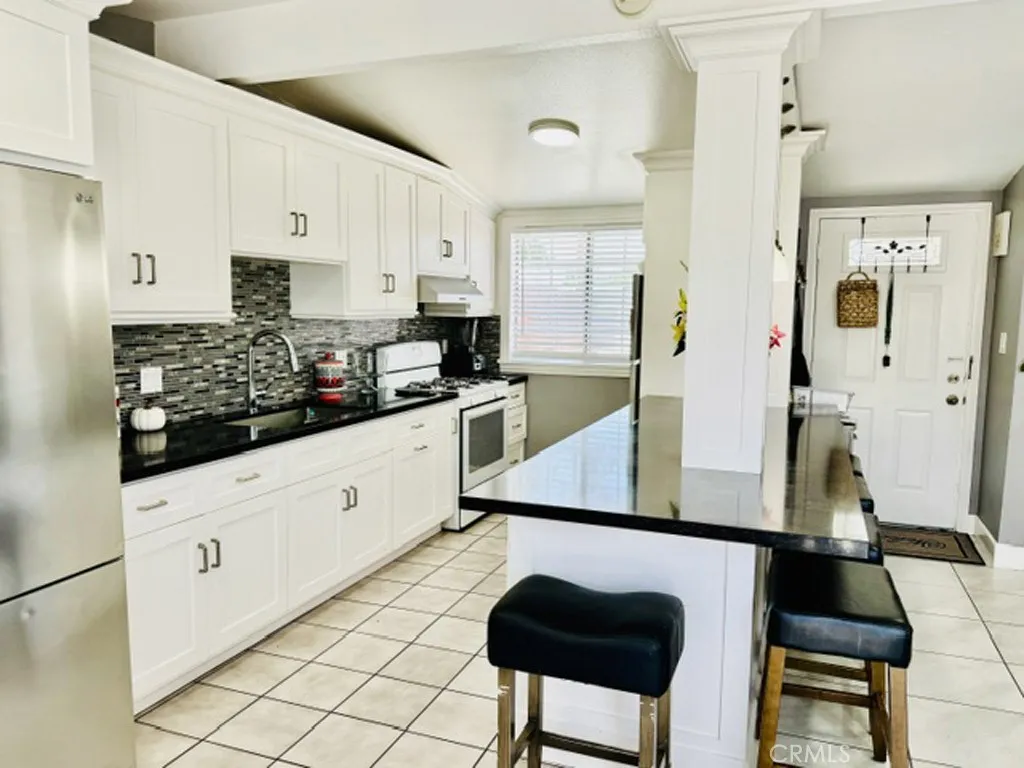 Kitchen featuring dual refrigerators