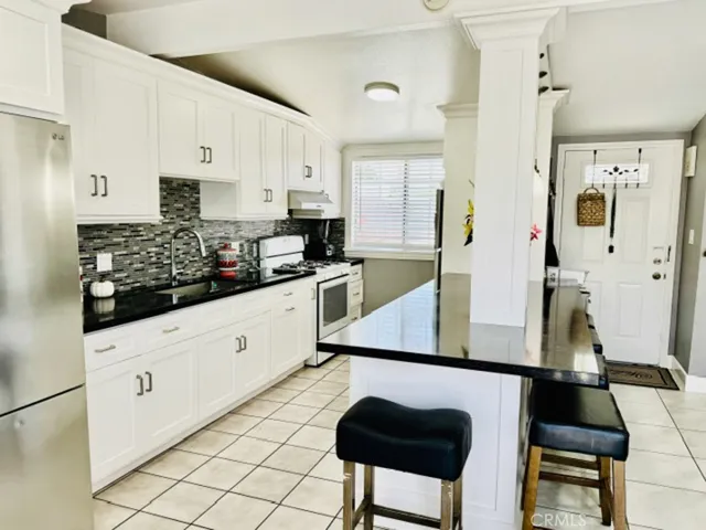 Kitchen featuring dual refrigerators