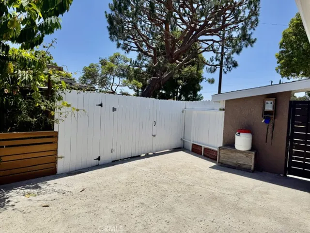 Main entrance with another small patio.