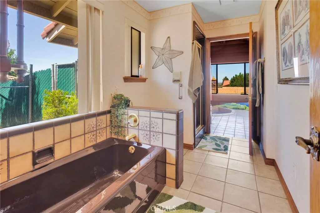 Primary Bathroom with tub and shower