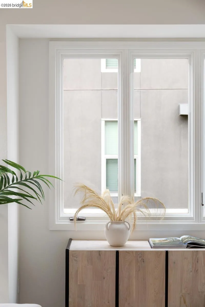 Large window with white trim and multiple panes Large window with white trim and multiple panes