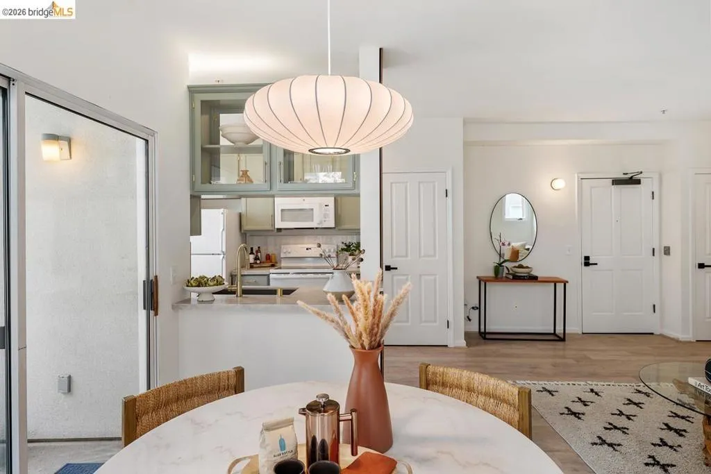 Open-concept living area with a contemporary pendant light fixture Open-concept living area with a contemporary pendant light fixture