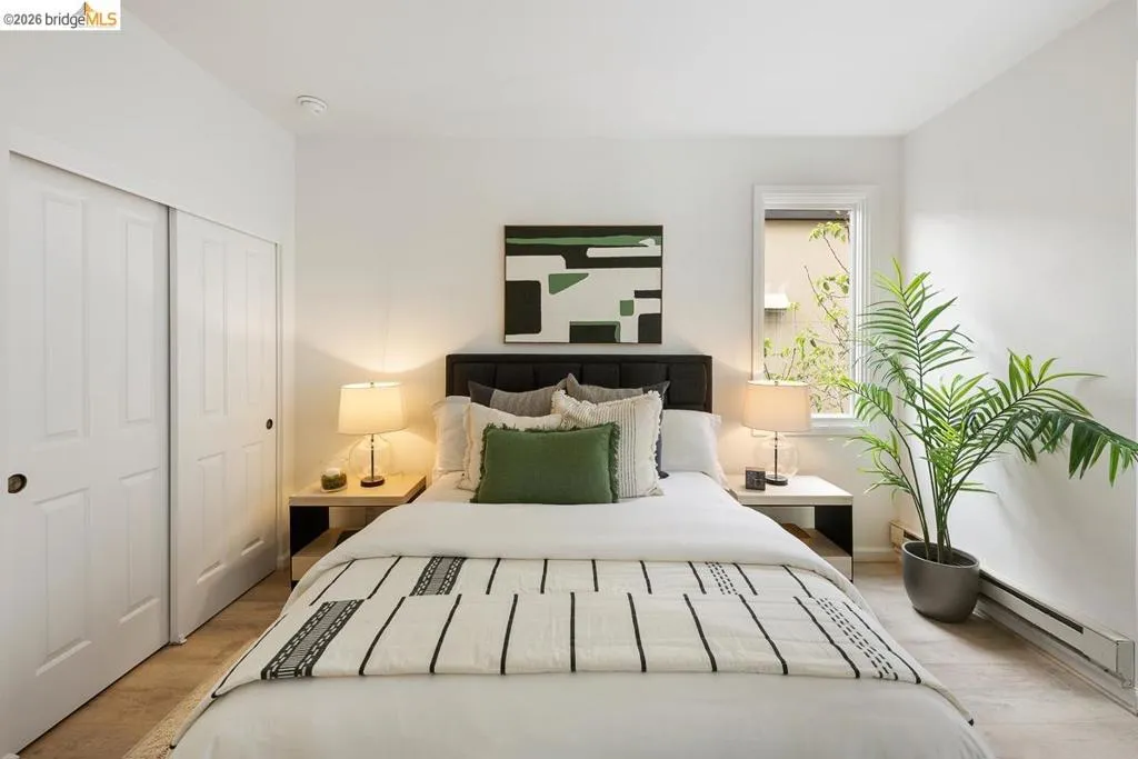 Bedroom featuring light-colored walls and carpet flooring Bedroom featuring light-colored walls and carpet flooring