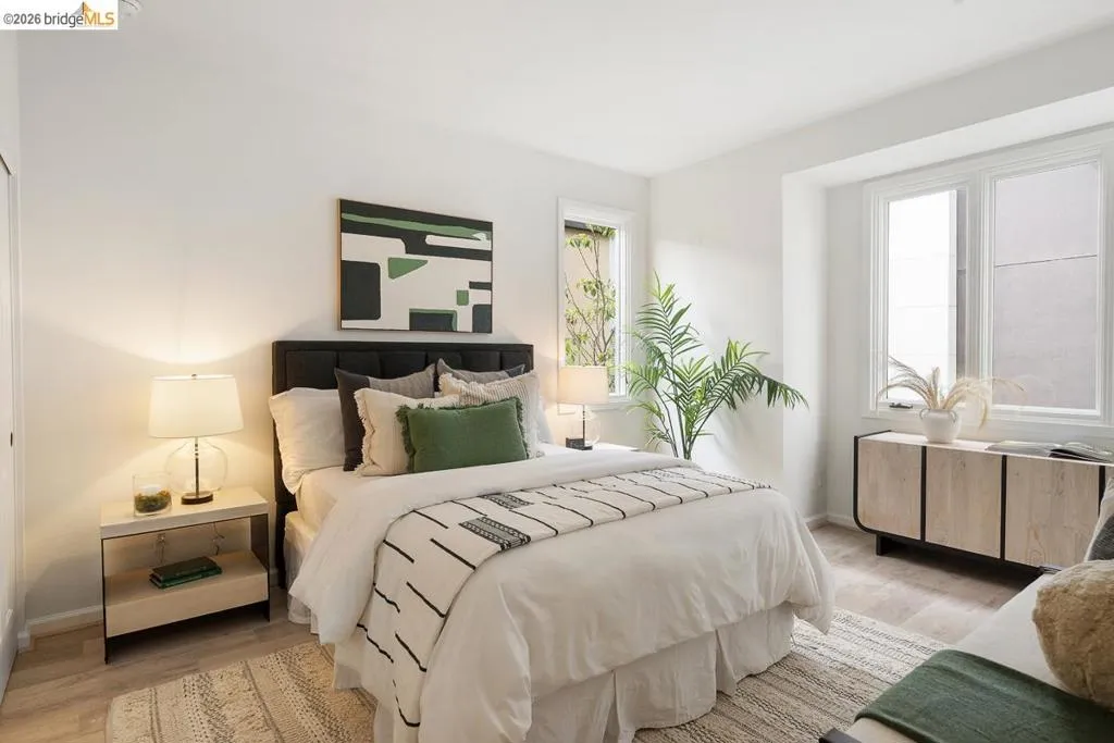 Bright room with wood-finish flooring and white walls Bright room with wood-finish flooring and white walls