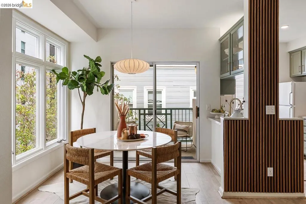 Dining area featuring a round marble-look table with an overhead pendant light fixture Dining area featuring a round marble-look table with an overhead pendant light fixture