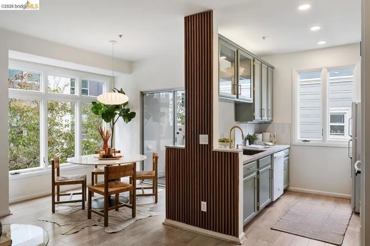 Open-concept living space with wood-finish flooring