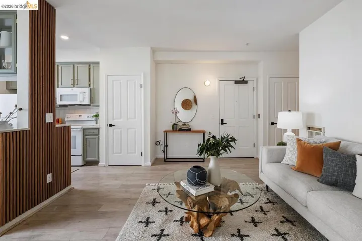 Open-concept living space featuring wood-finish flooring throughout