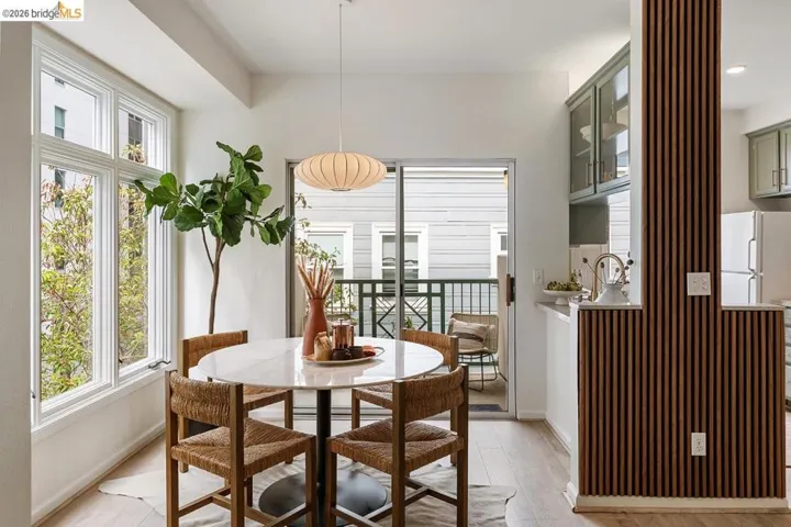 Dining area featuring a round marble-look table with an overhead pendant light fixture