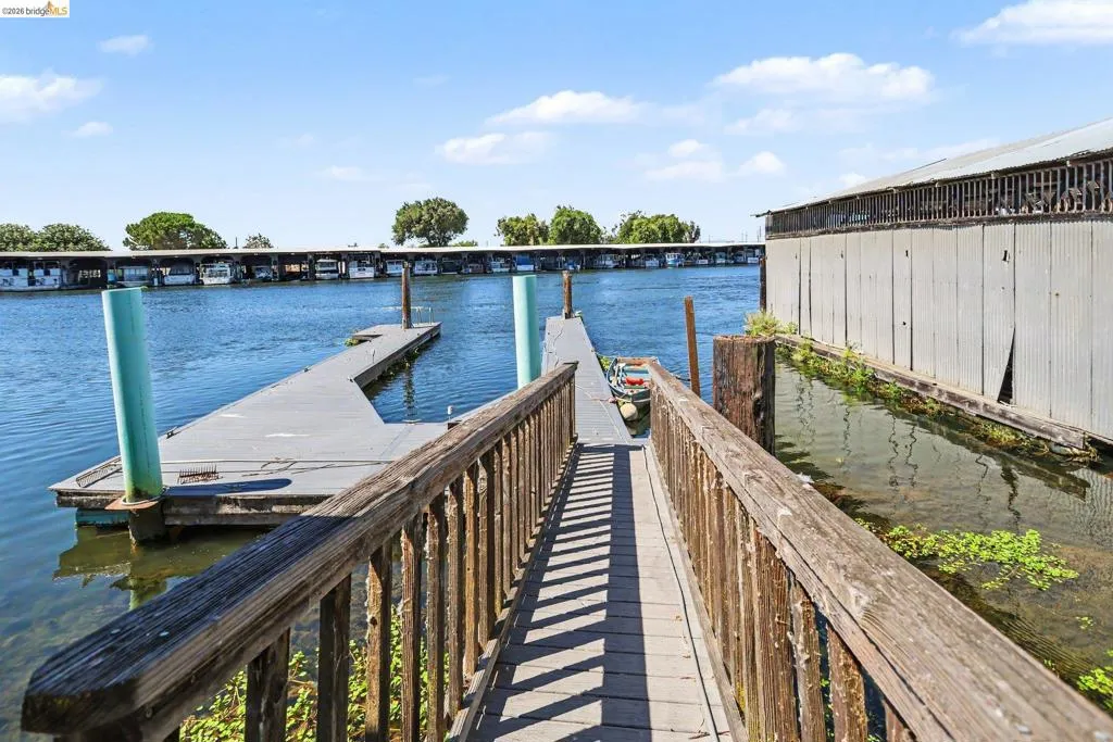 Private wooden dock and walkway providing water access