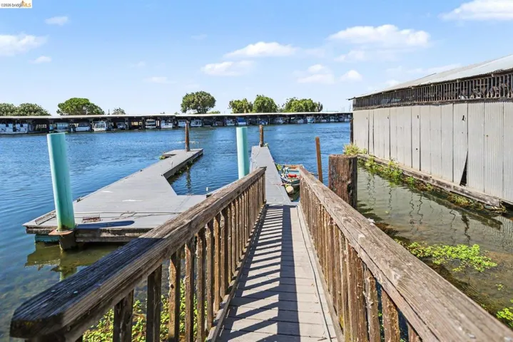 Private wooden dock and walkway providing water access