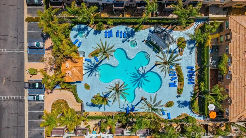 AERIAL OVERVIEW OF THE COMMUNITY'S RESORT-STYLE POOL, LOUNGE AREAS, AND BEAUTIFULLY LANDSCAPED GROUNDS.