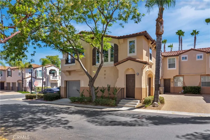 DESIRABLE CORNER-UNIT HOME IN THE GATED MONTEGO COMMUNITY, FEATURING ATTRACTIVE MEDITERREAN STYLE ARCHITECTURE, MATURE LANDSCAPING, PRIVATE ENTRY AND AN ATTACHED GARAGE.