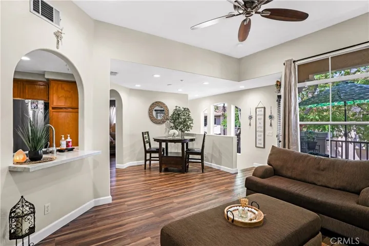 OPEN-CONCEPT LIVING AND DINING AREAS WITH EXTENDED COUNTER/BAR AREA.