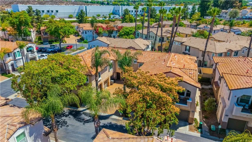 AERIAL VIEW HIGHLIGHTING THE HOME'S DESIRABLE CORNER LOCATION WITHIN THE GATED MONTEGO COMMUNITY.