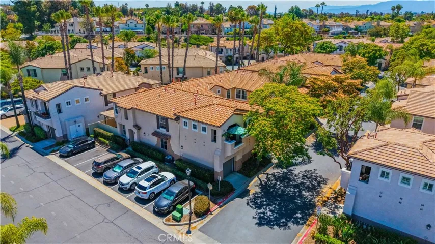 AERIAL VIEW HIGHLIGHTING THE HOME'S DESIRABLE CORNER LOCATION WITH NEARBY GUEST PARKING.