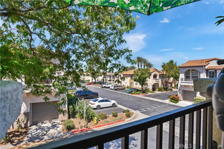 PRIVATE BALCONY OVERLOOKING THE COMMUNITY AND CORNER LOCATION.