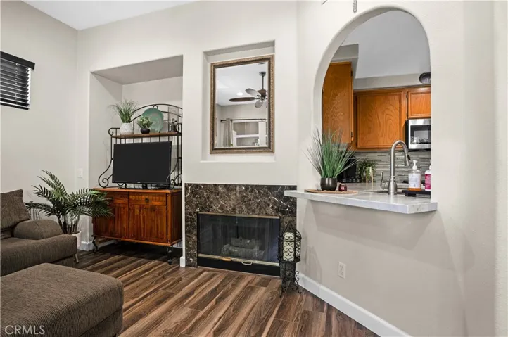 THOUGHTFULLY REDESIGNED EXTENDED COUNTER/BAR AREA WITH QUARTZ COUNTERTOPS.