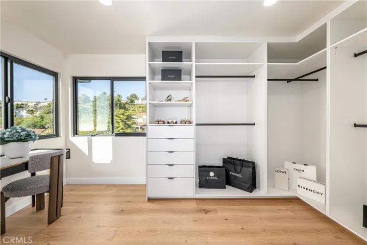 Primary bedroom walk-in closet