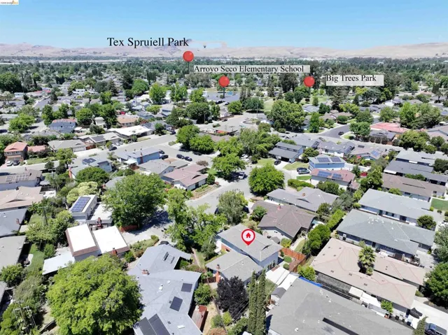 Aerial perspective showcasing a residential neighborhood with a variety of single-story and two-story homes