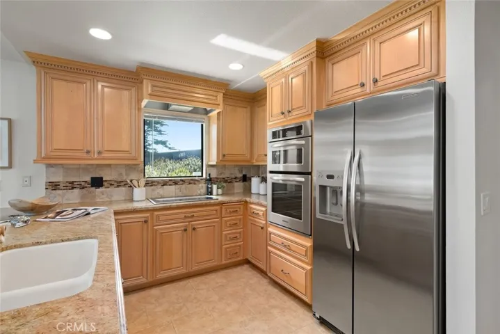 Kitchen Aid and Dacor Appliances included.