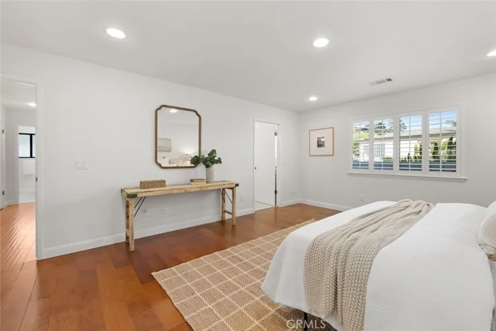 Primary suite, door to hall and bathroom