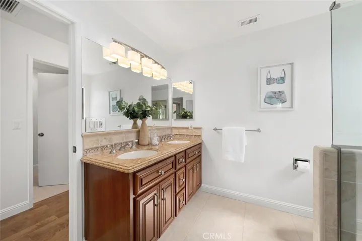 First bathroom, double sinks and access to guest bedroom