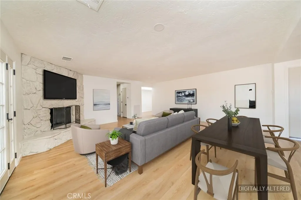 Family Room (Disclaimer: Some images have been digitally enhanced with virtual staging to illustrate potential room layouts and furnishings. Actual property condition and features may vary. Buyer to verify all information independently).